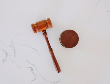 brown wooden smoking pipe on white surface